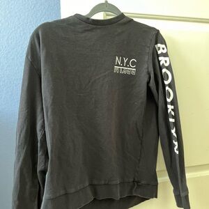 Grey long sleeve New York shirt.